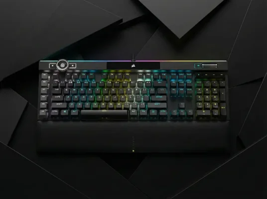 Corsair K100 RGB flagship mechanical keyboard with iCUE control wheel and Elgato Stream Deck integration.