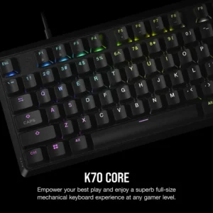 Angled view of Corsair K70 Core keyboard showing colorful RGB lighting under the keycaps.