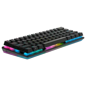 Low angle side perspective of the Corsair K70 PRO MINI WIRELESS keyboard showing RGB lighting reflecting off the desk.