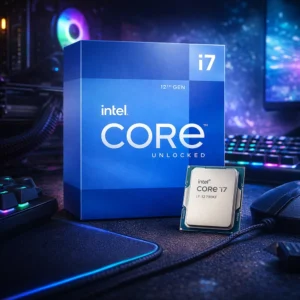 Intel Core i7-12700KF retail box on a carbon fiber texture desk in a blue-lit room.