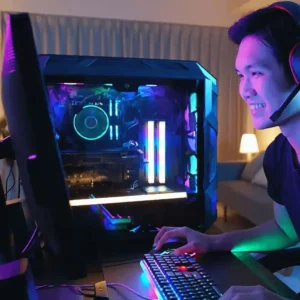 Happy gamer playing on a high-end PC rig equipped with RGB lighting and MSI hardware.