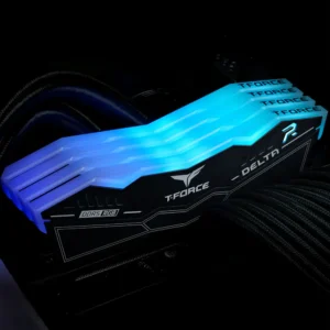 TeamGroup Delta RGB DDR5 memory modules glowing with cool blue LED lighting in a dark PC build.